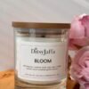 Close up of DitsyJaffa Bloom hand-poured candle focusing on label