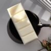 Flat lay top view of a DitsyJaffa Cacao Dust wax melt snap bar
