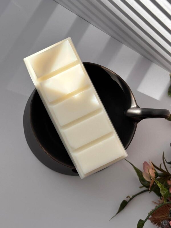Flat lay top view of a DitsyJaffa Cacao Dust wax melt snap bar