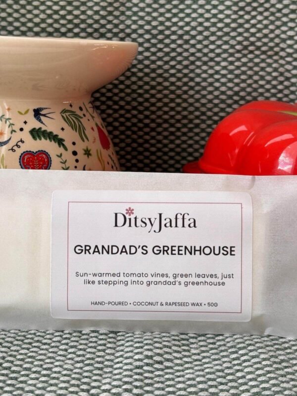 Close up of DitsyJaffa Grandad's Greenhouse hand-poured wax melt focusing on label
